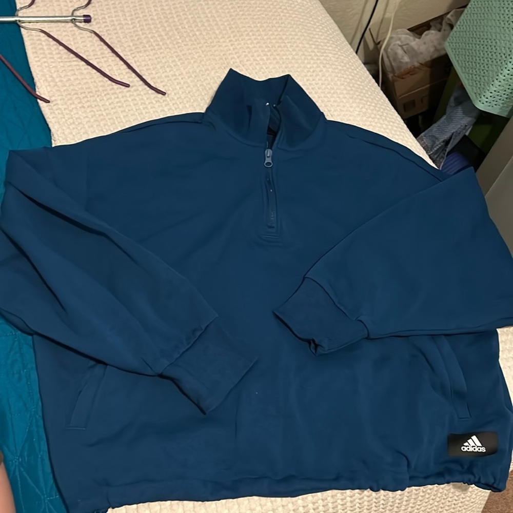 Adidas sweatshirt XL. It’s a cropped sweatshirt